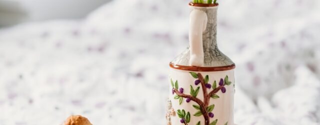 three assorted-color petaled flowers in vase on serving tray